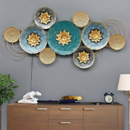 Golden Circular Wall Art with Floral Details and Warm Lighting